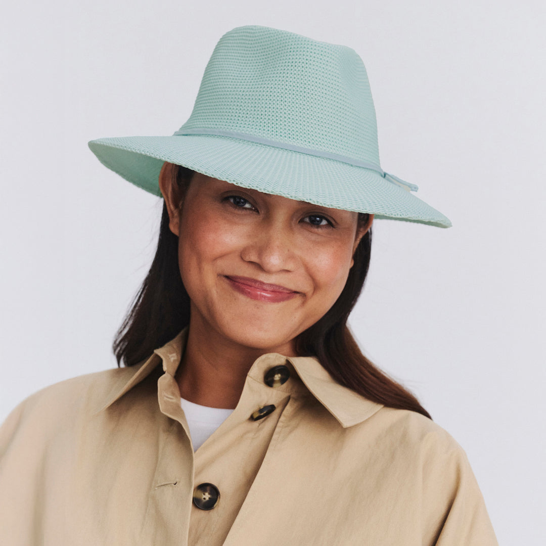 Female model wearing Jacqui Mannish Hat in mint blue colour, front view showcasing fit and sun-protective wide brim