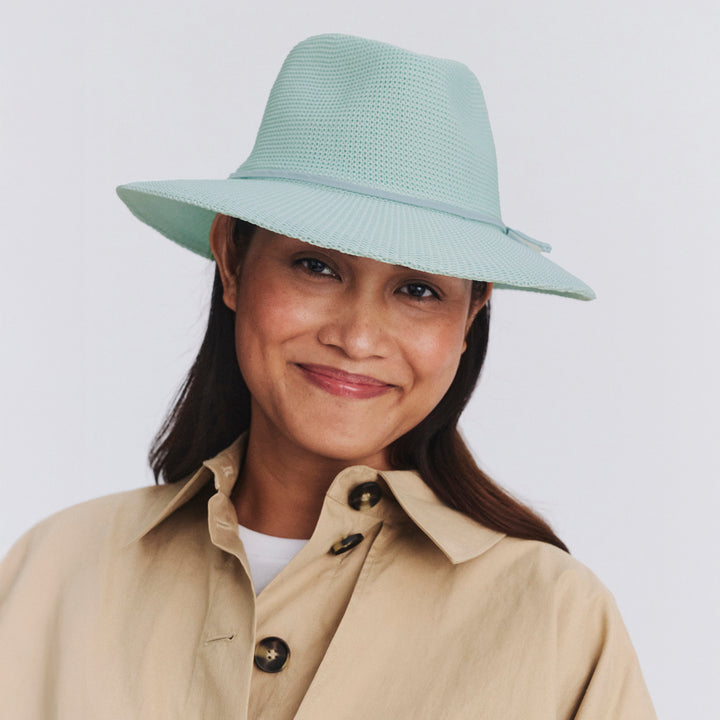 Female model wearing Jacqui Mannish Hat in mint blue colour, front view showcasing fit and sun-protective wide brim