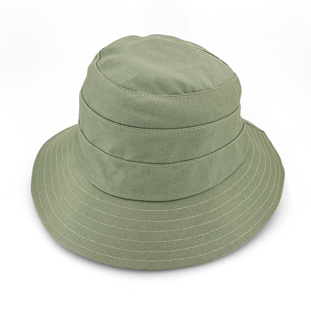 Golf Bucket Hat in sage colour, side view highlighting classic bucket shape, stitching detail, and sun-protective brim coverage