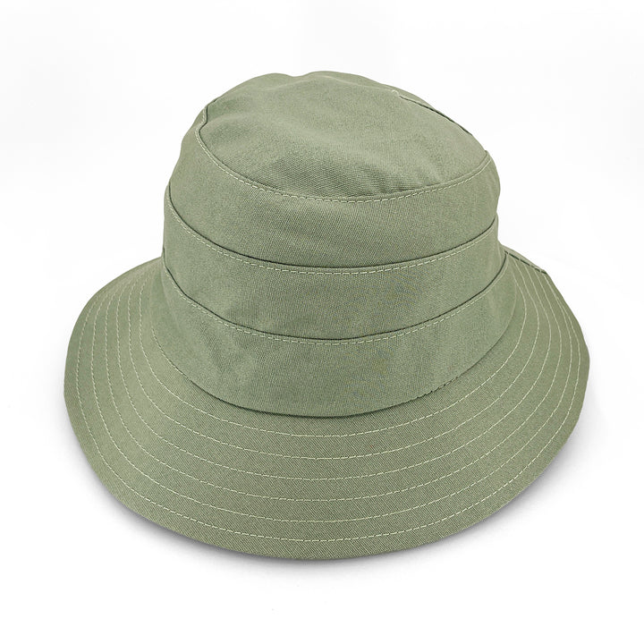 Golf Bucket Hat in sage colour, side view highlighting classic bucket shape, stitching detail, and sun-protective brim coverage