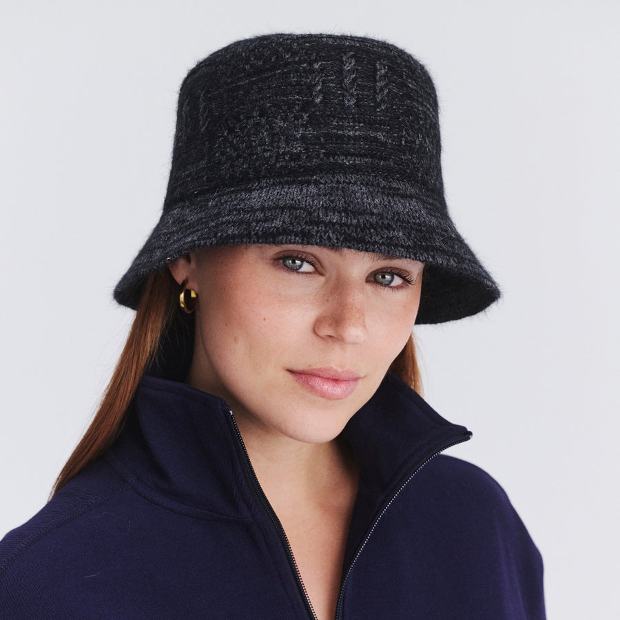 Female model wearing Jordan Bucket Hat in black soft wool, front view styled with casual outfit