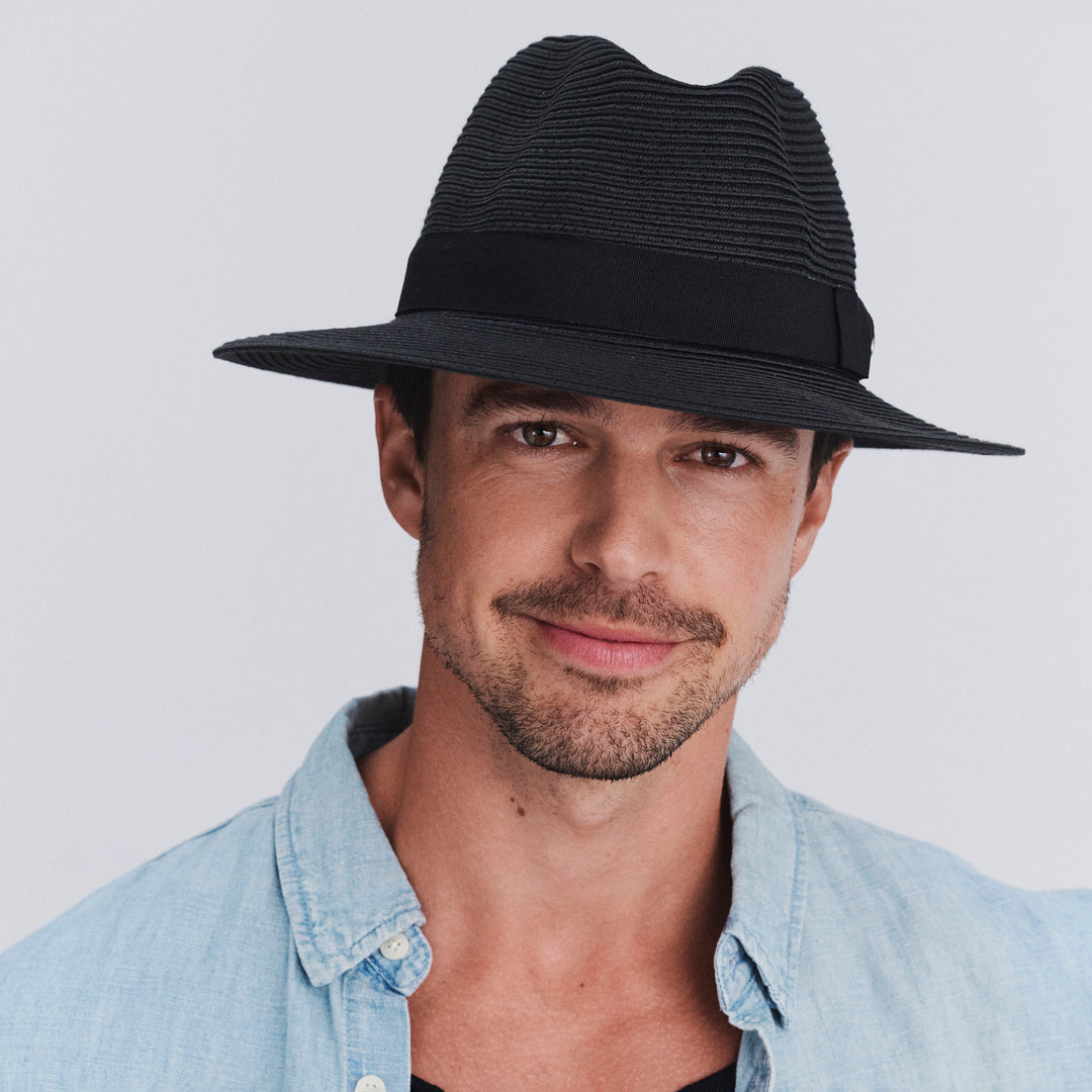 Male model wearing Cafe Fedora Hat in Black colour, front view showcasing fit and wide brim
