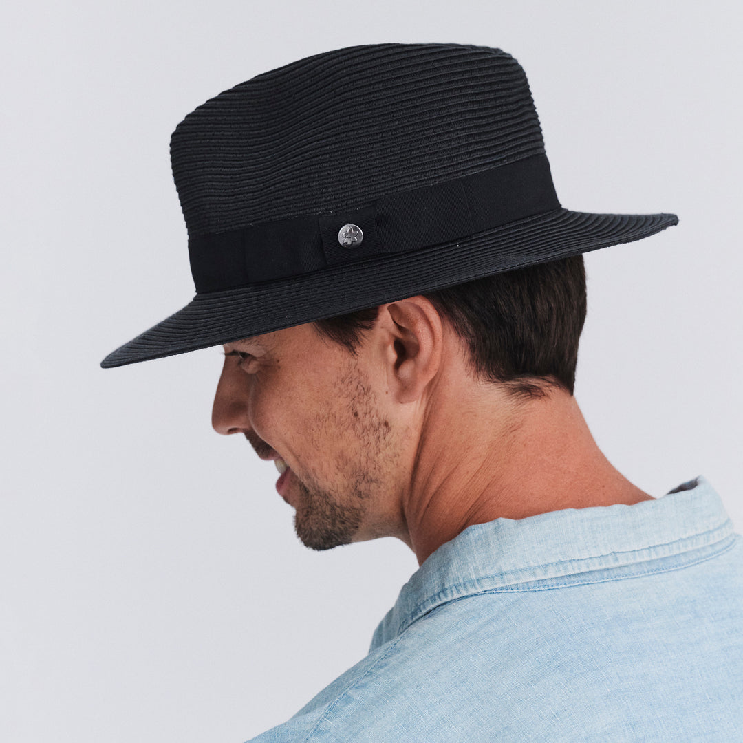 Male model wearing Cafe Fedora Hat in Black colour, side profile showing brim coverage