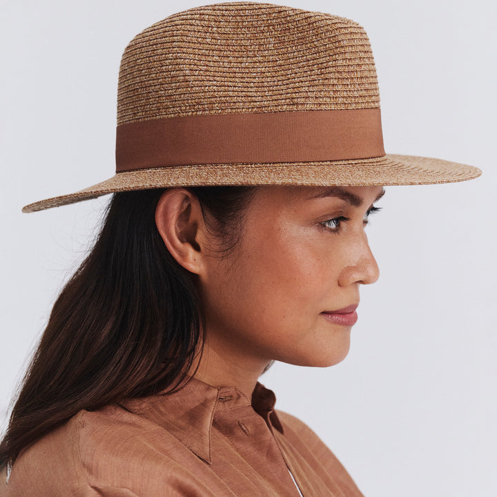 Female model wearing Cafe Fedora Hat in Cinnamon colour, side profile showing brim coverage