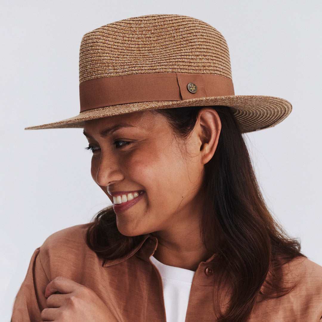 Female model wearing Cafe Fedora Hat in Cinnamon colour, three-quarter angle highlighting shape and silhouette