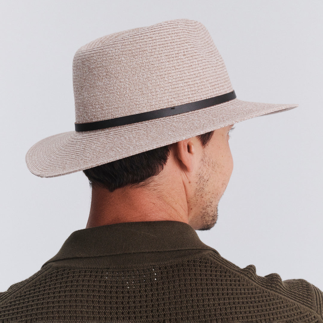 Back view of model wearing Darby fedora hat in Camel Mix showing brim shape and rear detailing