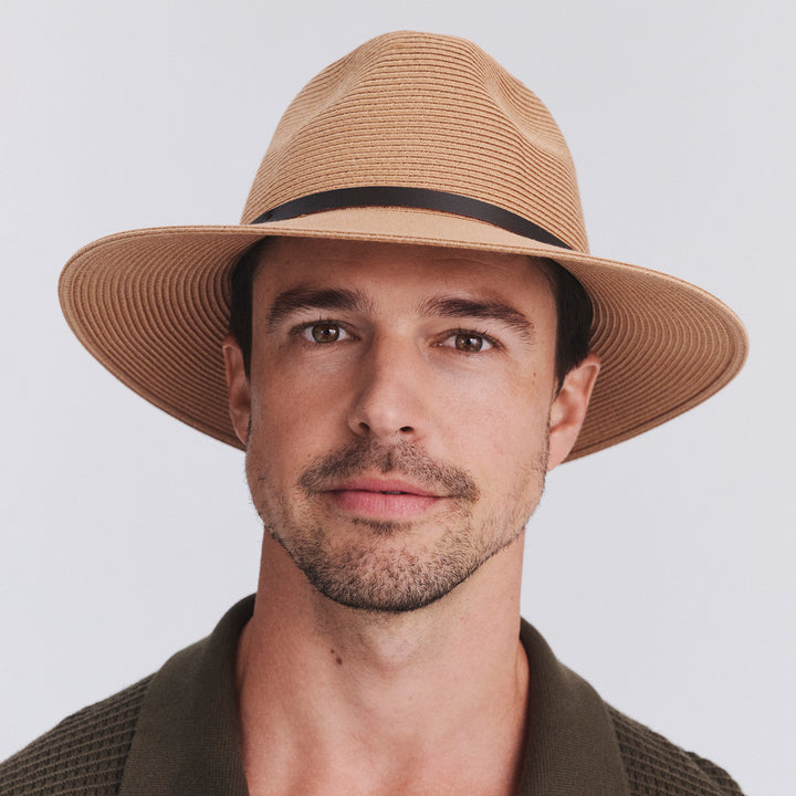 Model wearing Darby fedora hat in Sahara, front‑facing view”
