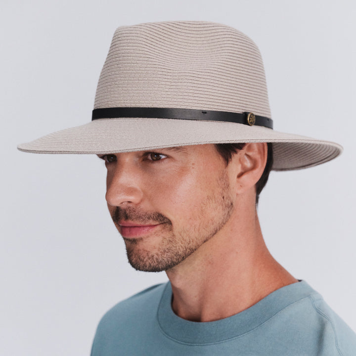 Model wearing Darby fedora hat in Stone, three‑quarter angle