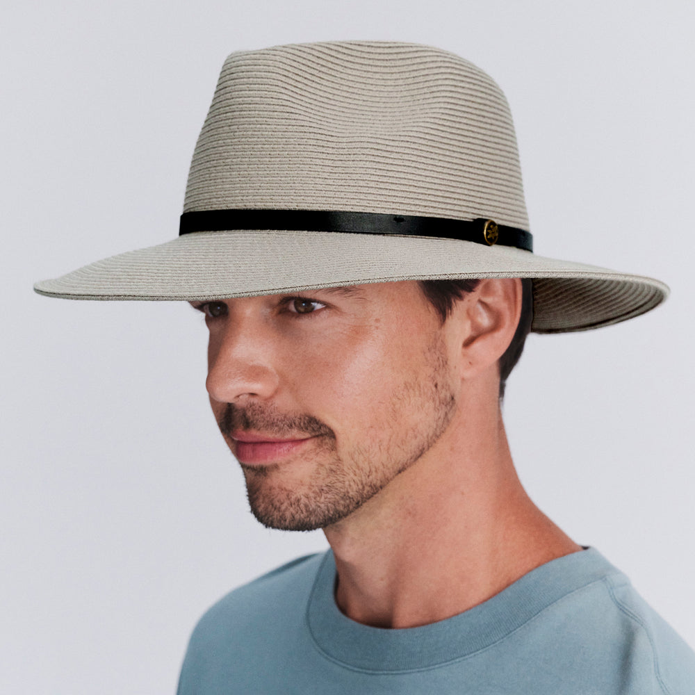 Model wearing Darby fedora hat in Stone, three‑quarter angle