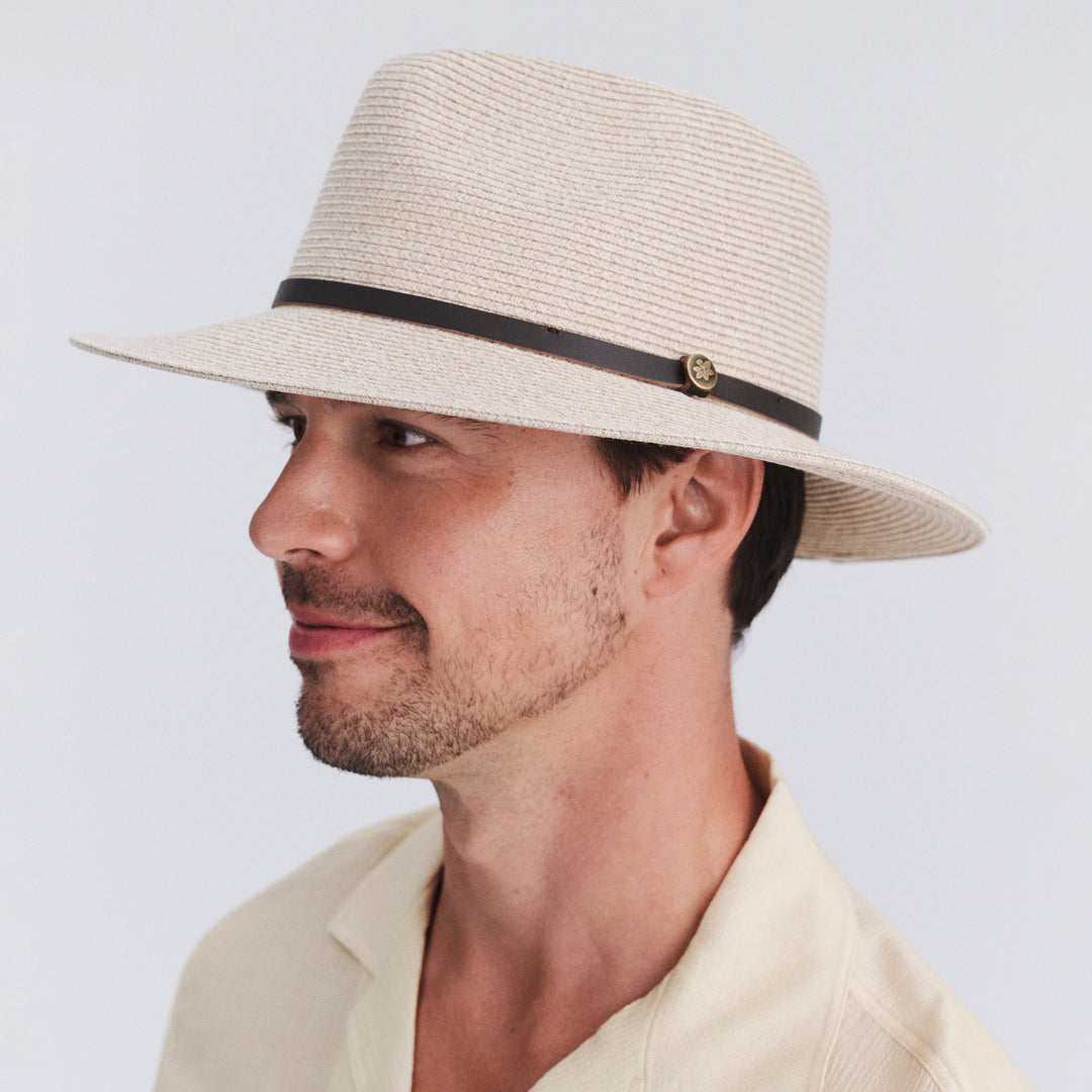 Male model wearing Darby fedora hat in Wheat, three‑quarter angle
