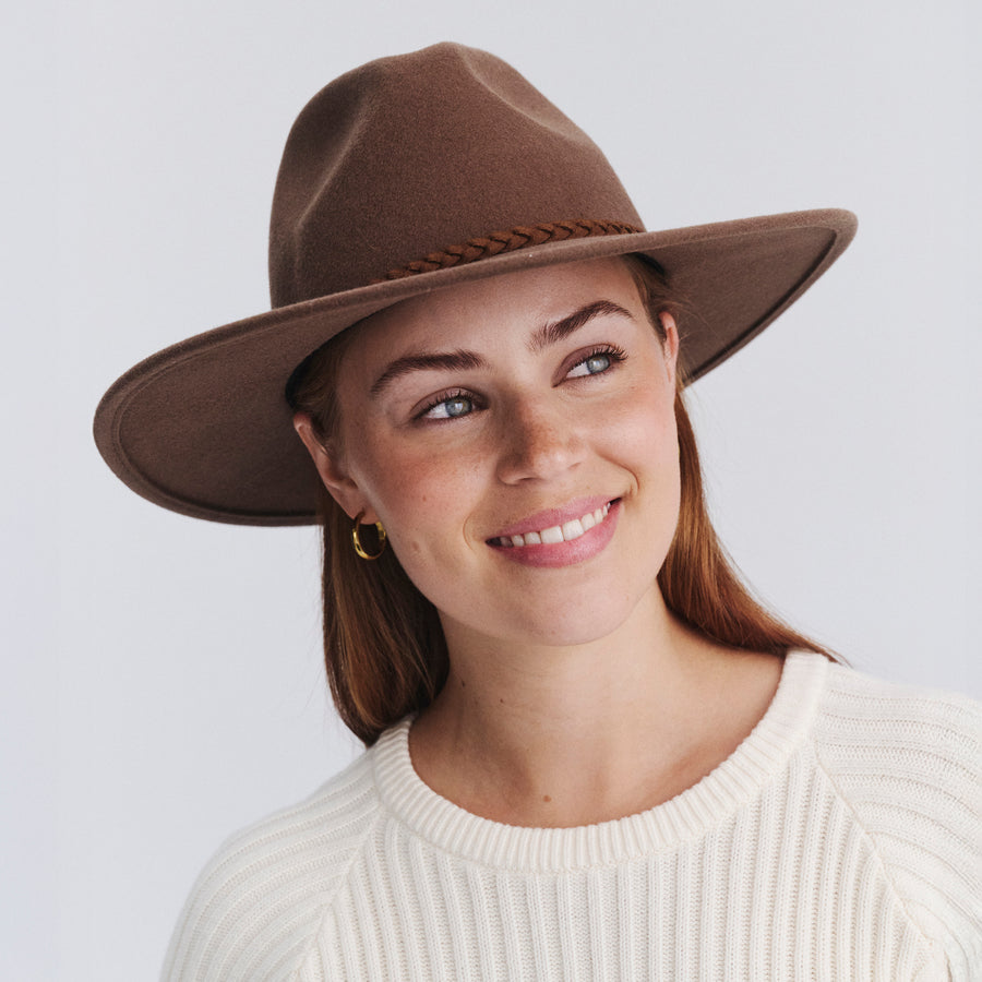 Female model wearing Blake felt fedora hat in Chocolate, front‑facing view