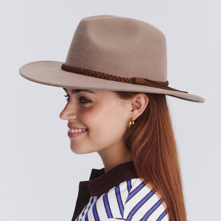 Female model wearing Blake Felt Fedora in mushroom colour, side profile showing brim width