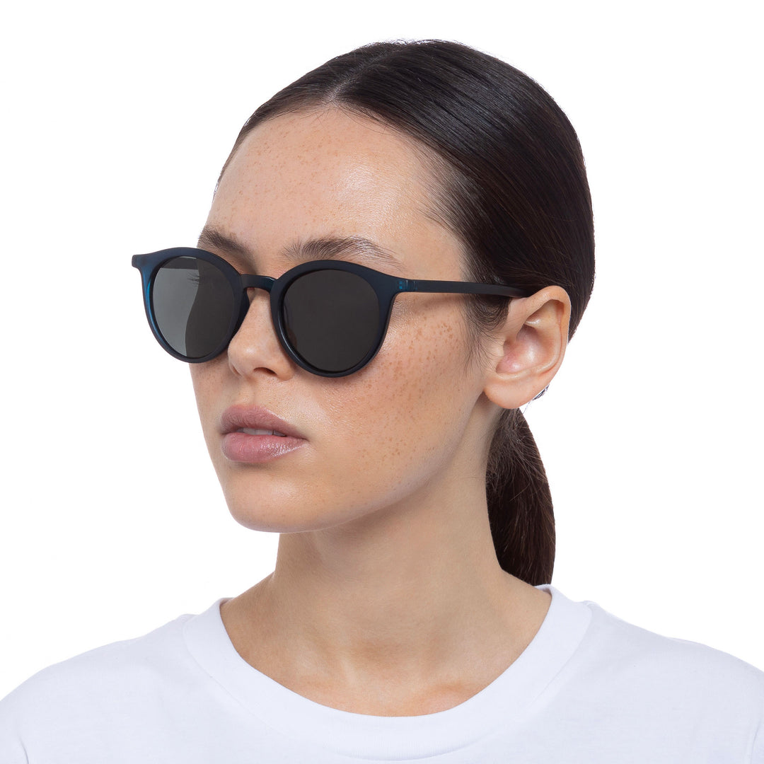 Cancer Council | Baines Sunglasses - Female Model Angle | Matte Navy | UPF50+ Protection
