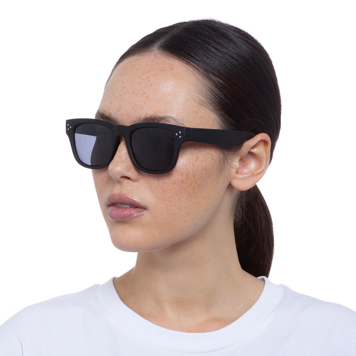 Cancer Council | Noddy Youth Sunglasses - Female Model Angle | Matte Black | UPF50+ Protection