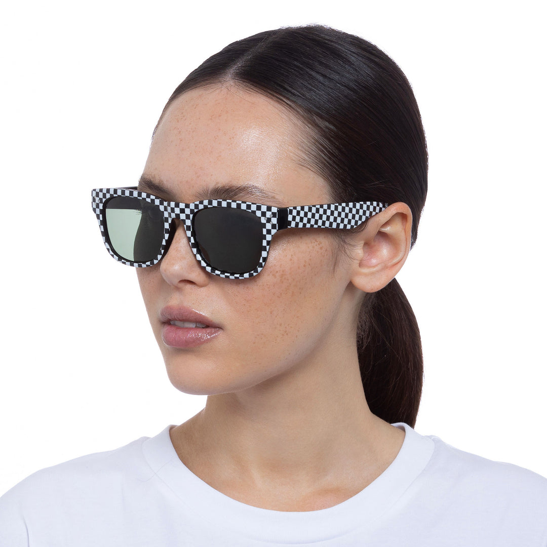 Cancer Council | Noddy Youth Sunglasses - Female Model Angle | Black White Check | UPF50+ Protection