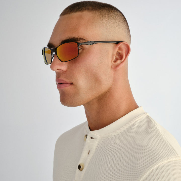 Side profile of male model wearing Leederville sunglasses in Black