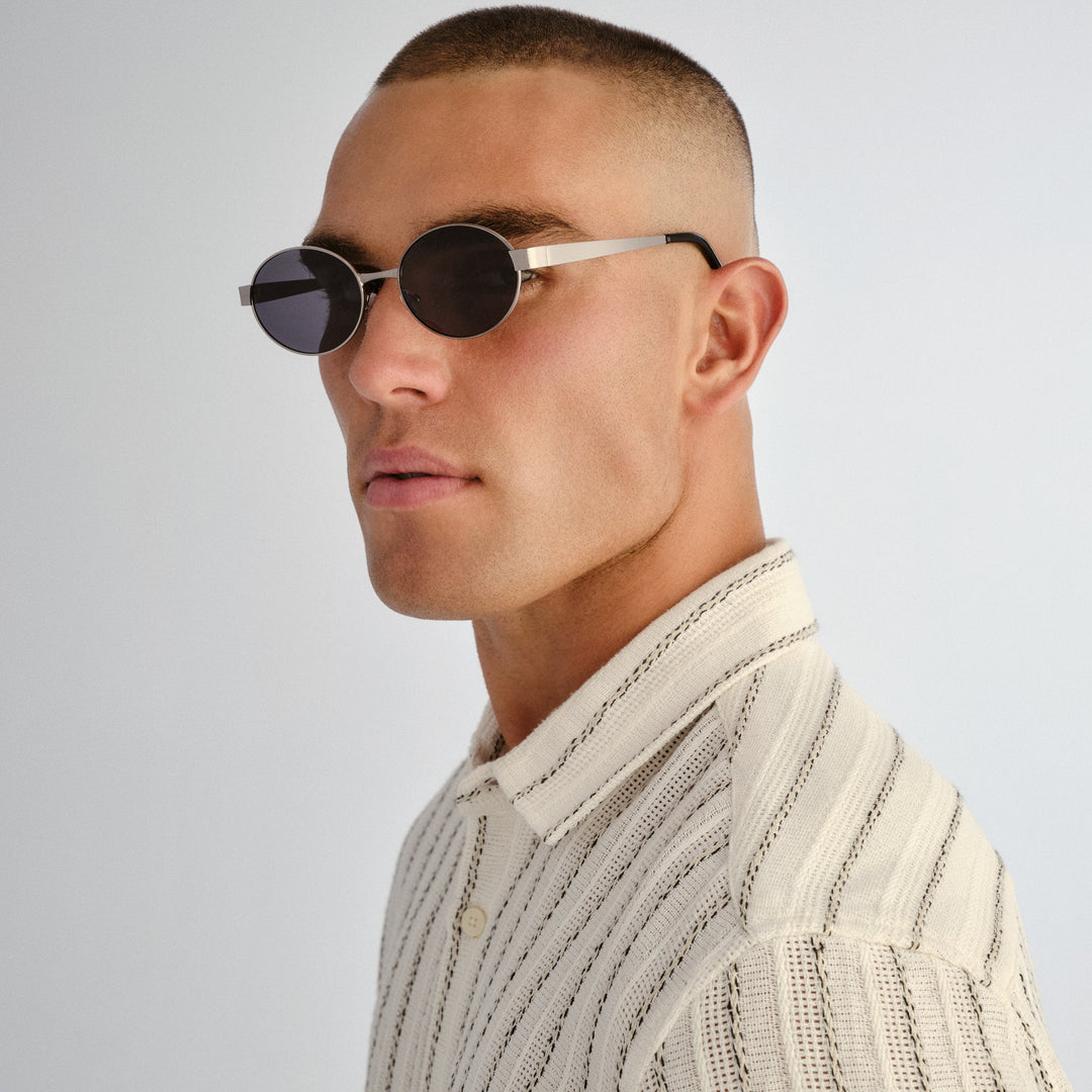 Side profile of female model wearing Norwood sunglasses in Gunmetal