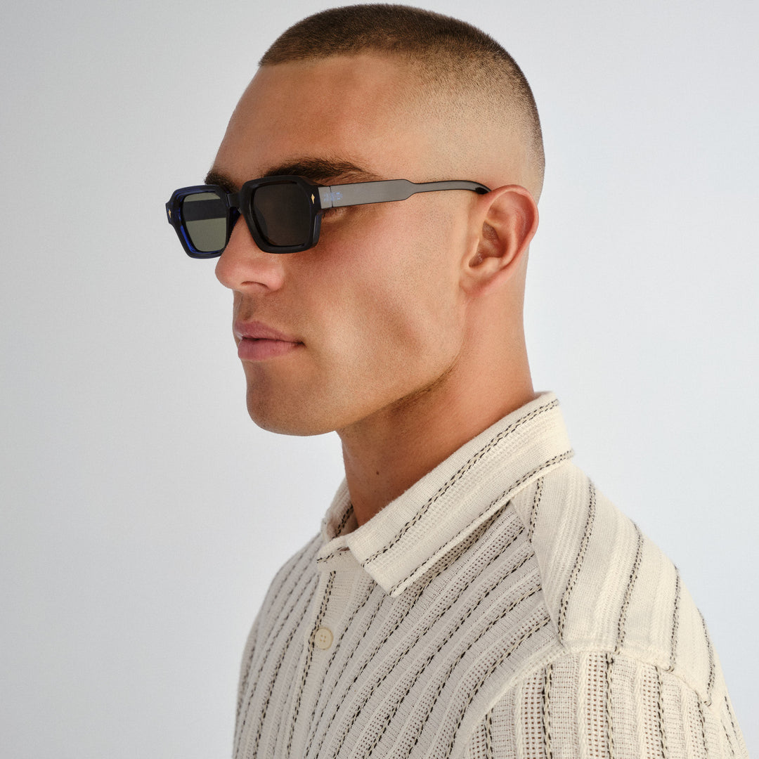 Side profile of male model wearing Mount Lawley sunglasses in Ink Blue