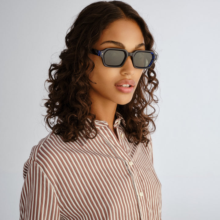 Front profile of female model wearing Mount Lawley sunglasses in Ink Blue