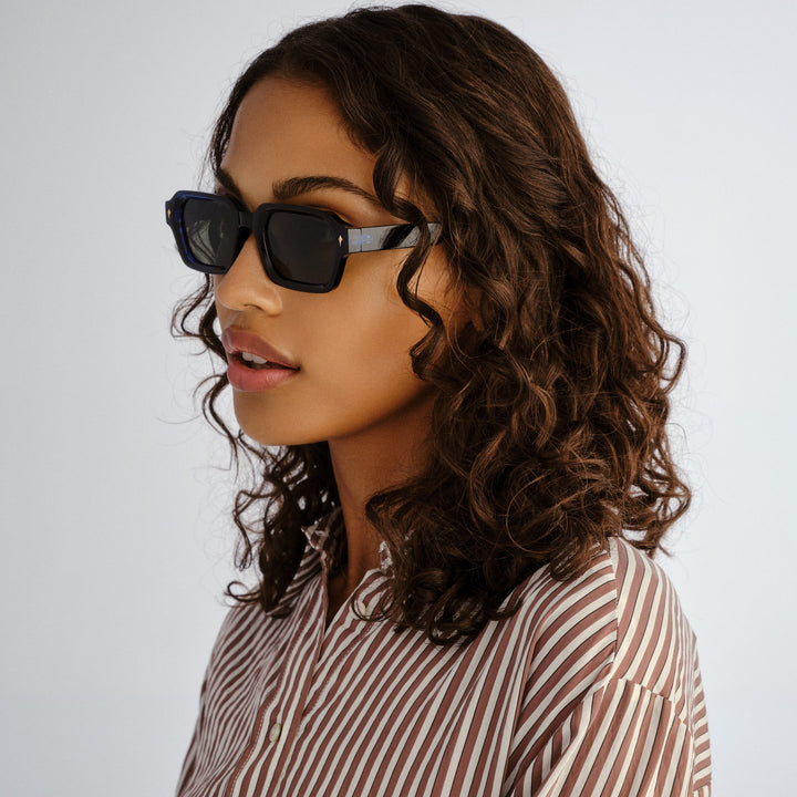 Side profile of female model wearing Mount Lawley sunglasses in Ink Blue