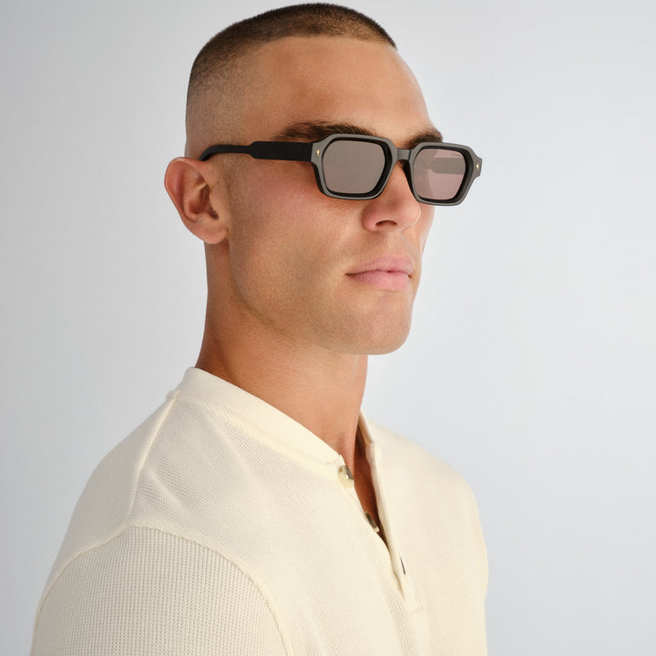 Male model wearing Mount Lawley sunglasses in Black, three‑quarter angle