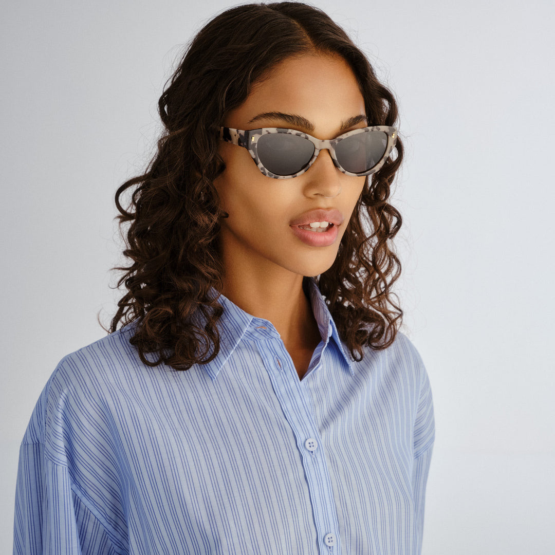 Front profile of female model wearing Swanbourne sunglasses in Graphic Tort