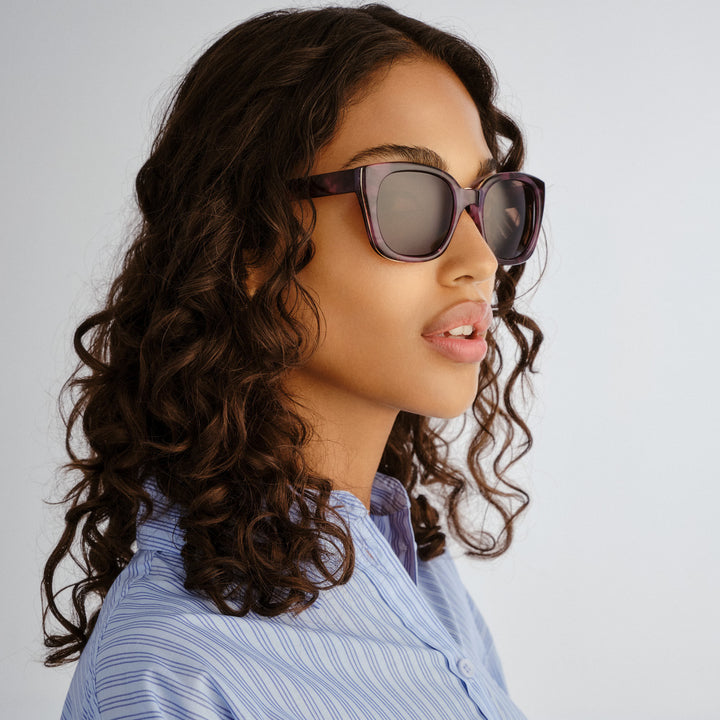 Side profile of female model wearing Teneriffe sunglasses in Purple Haze