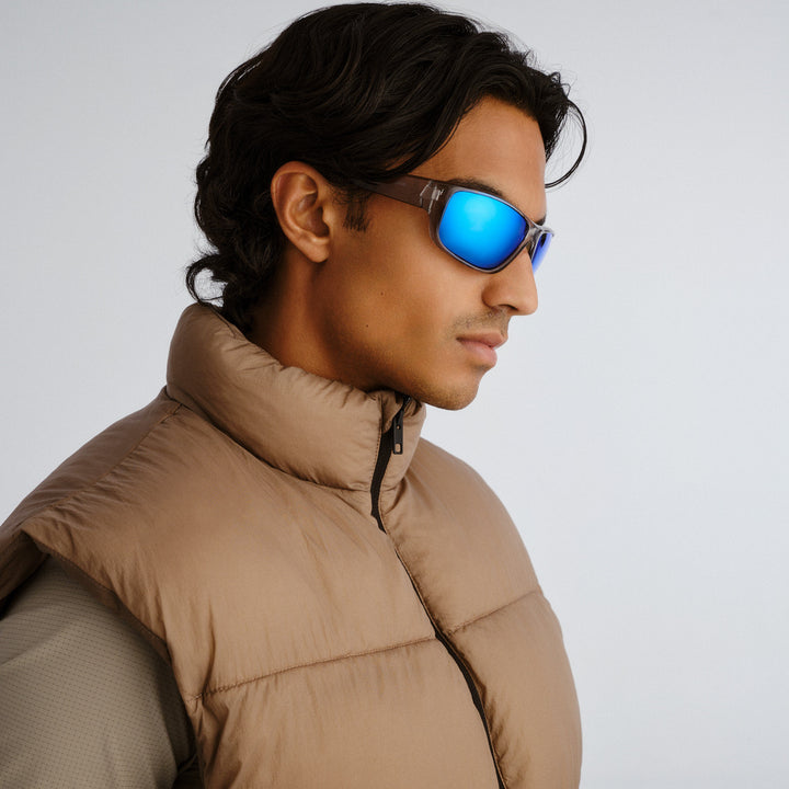Side profile of male model wearing Dundee sunglasses in Clear