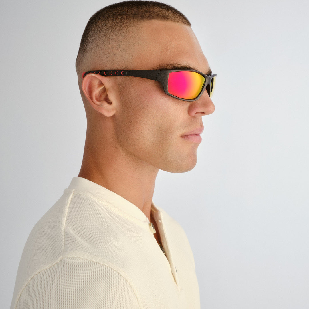 Side profile of male model wearing Barton sunglasses in Matte Metallic Grey