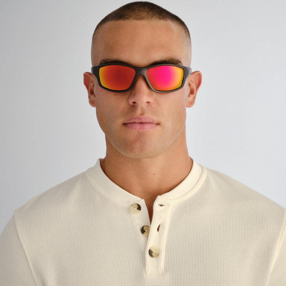 Male model wearing Barton sunglasses in Matte Metallic Grey, front view
