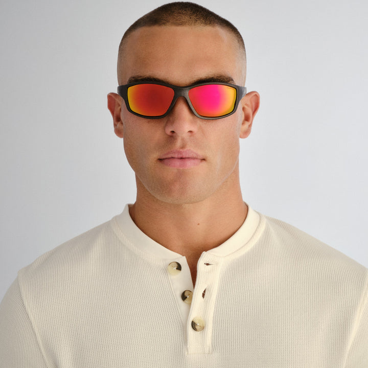Male model wearing Barton sunglasses in Matte Metallic Grey, front view