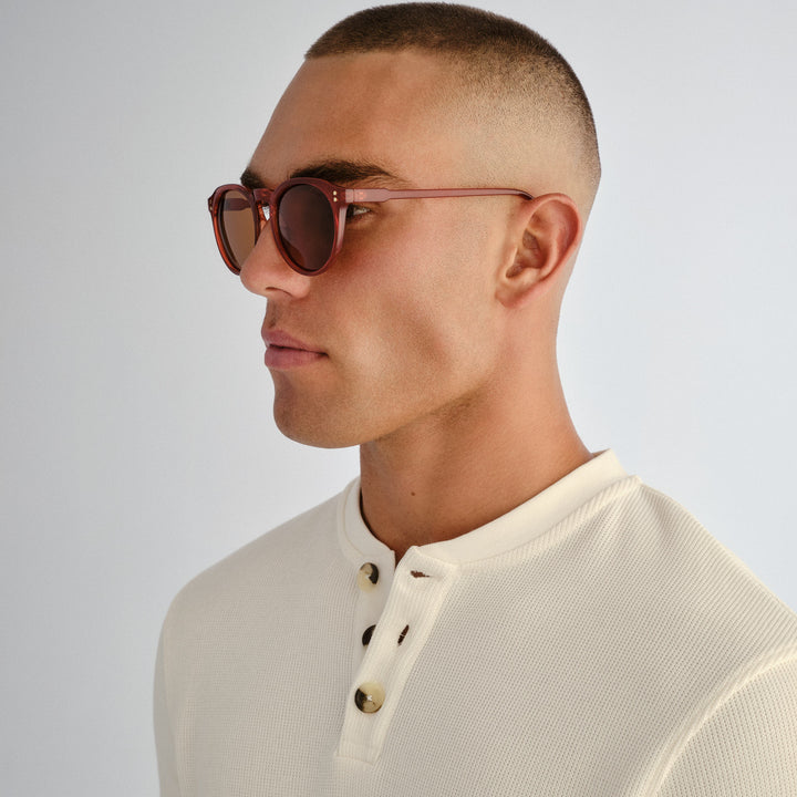 Side profile of male model wearing Bright sunglasses in Merlot
