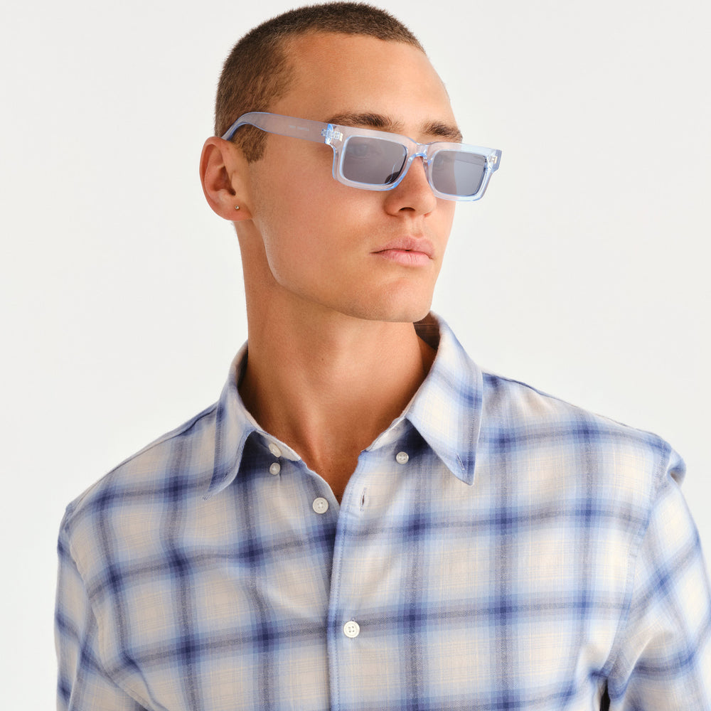 Male model wearing Austinmer Sunglasses in Ice Blue, front facing 