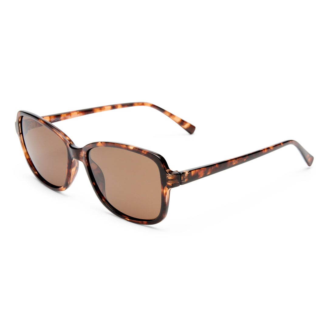 Sunglasses with tortoiseshell frame and brown lenses on a white background
