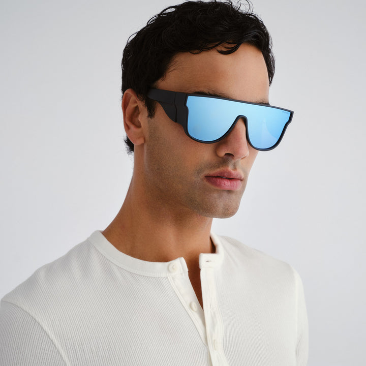 Man wearing futuristic sunglasses with a white background