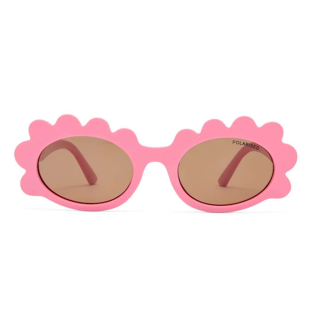 Triceratops kids sunglasses in matte pink, front view showing fun frame shape and tinted lenses