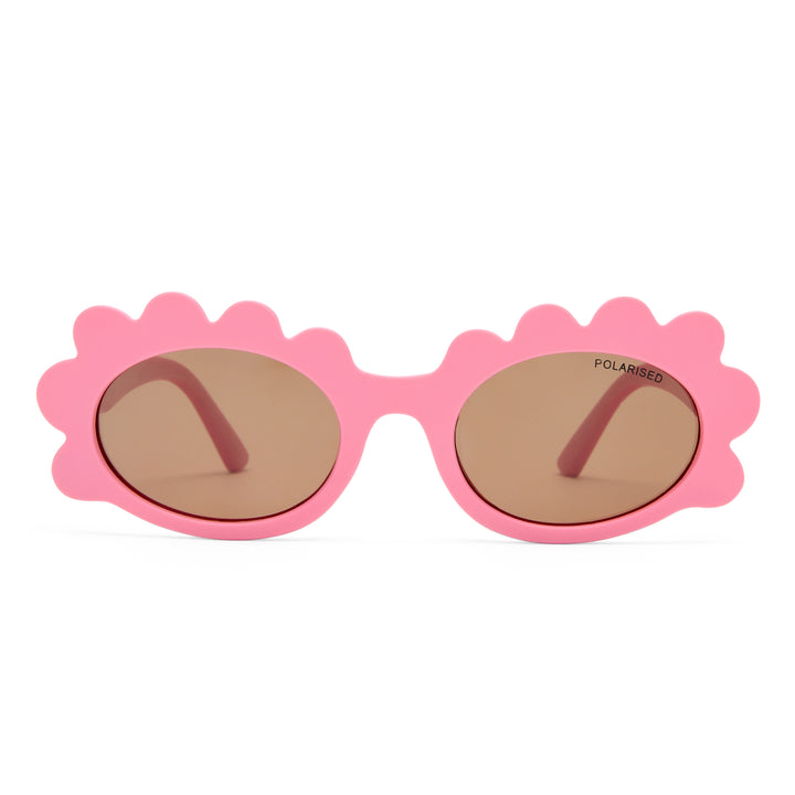 Triceratops kids sunglasses in matte pink, front view showing fun frame shape and tinted lenses