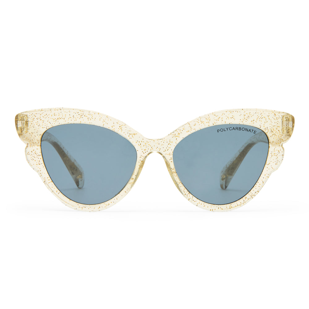 Cat-eye sunglasses with a textured, glittery champagne gold acetate frame and muted blue-gray lenses, shown against a plain white background.