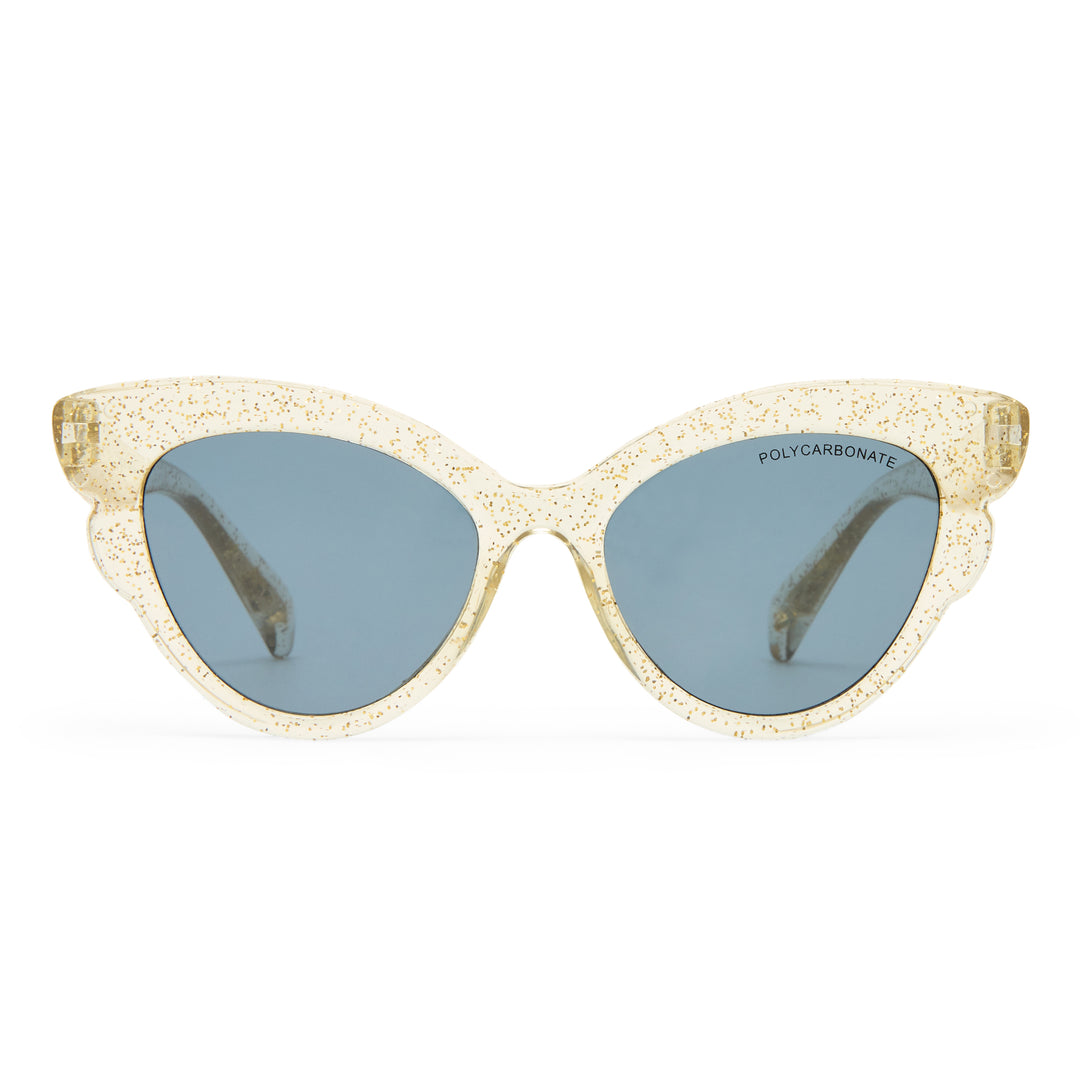 Cat-eye sunglasses with a textured, glittery champagne gold acetate frame and muted blue-gray lenses, shown against a plain white background.